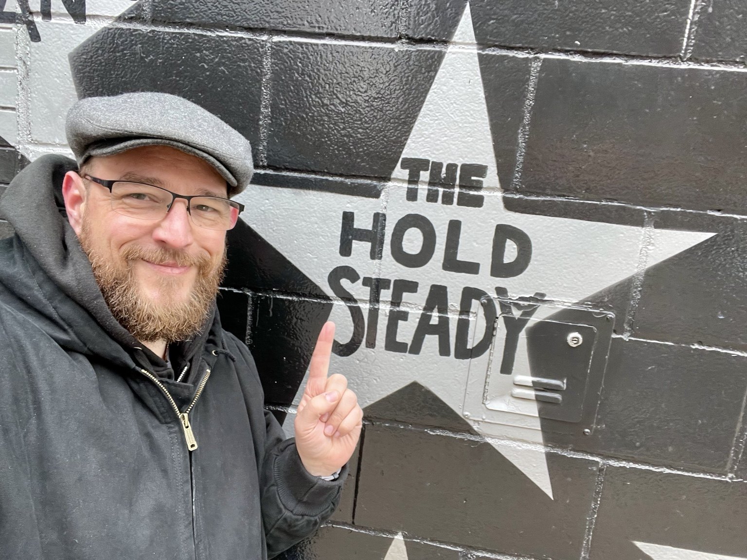 A fan pointing to The Hold Steady star at First Avenue